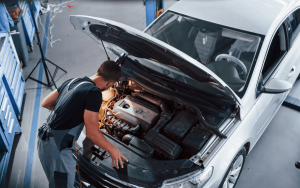An auto mechanic fixing a car
